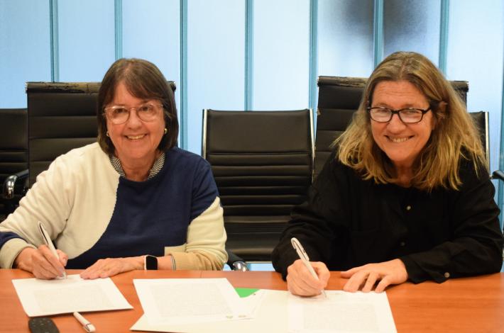 Gladys Ceretta y Silvana Pissano firman acuerdo de cooperación.